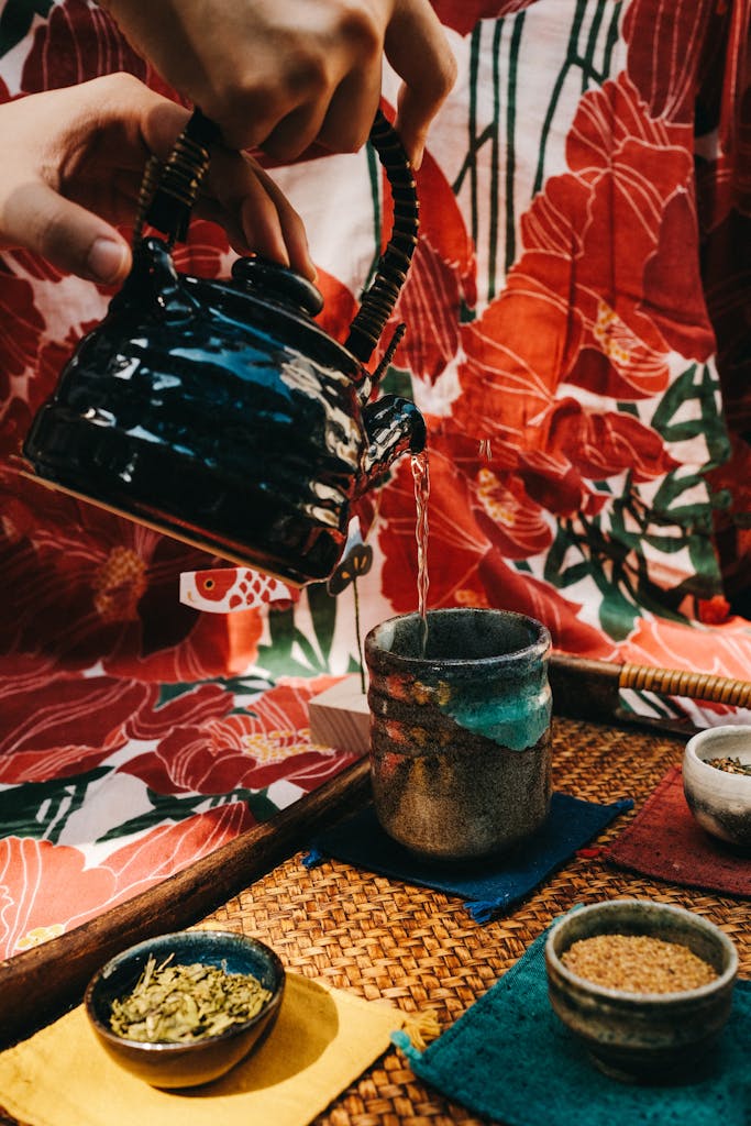 Pouring Tea on a Cup