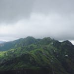 Breathtaking view of lush mountains under cloudy skies in Madagascar.